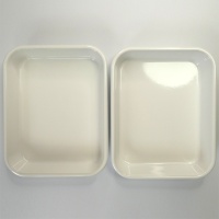 Two white enamel cooking trays