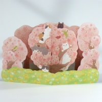 Pop up greetings card with cats sitting in pink cherry blossom trees